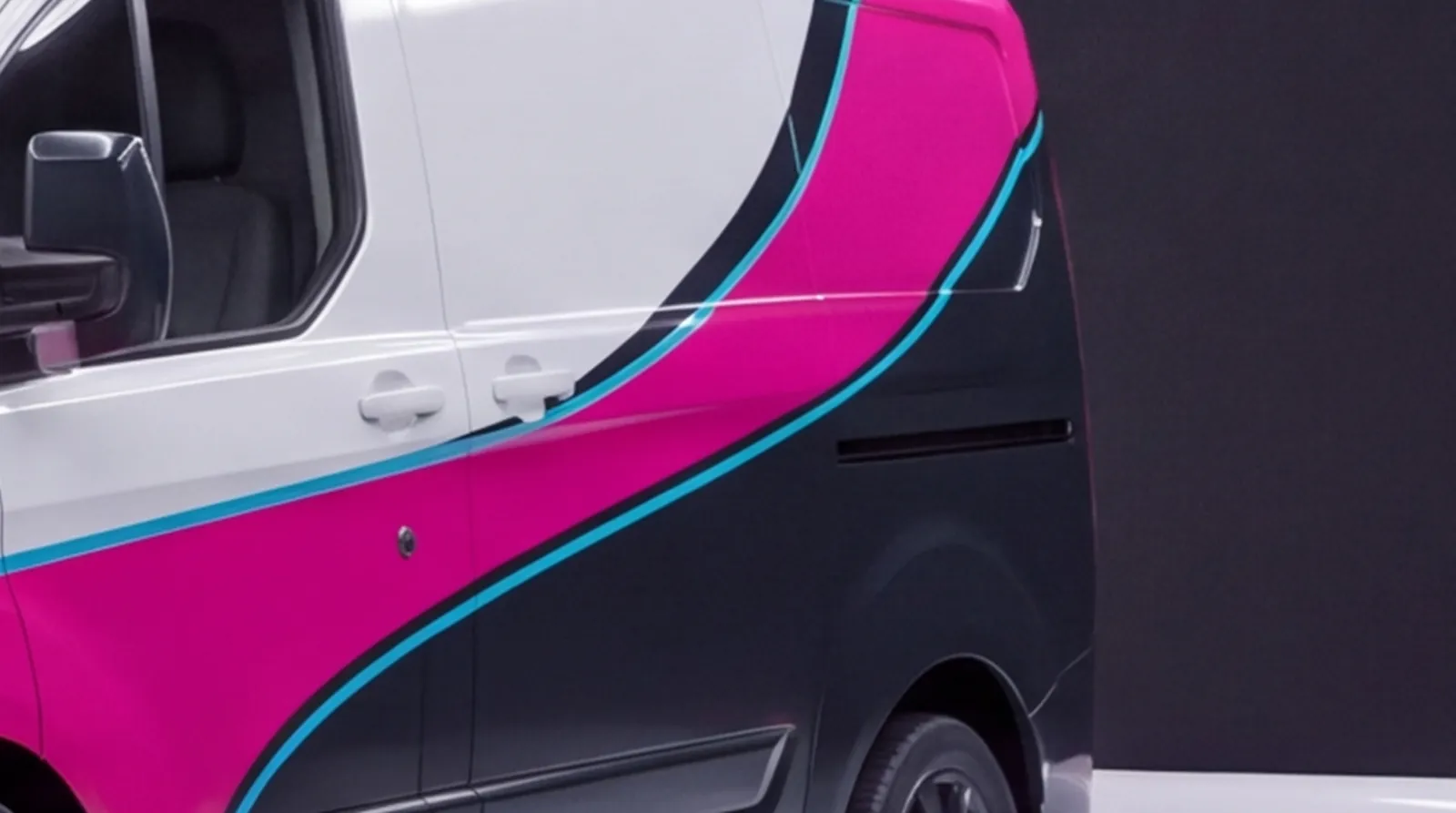 Close-up of the van's doors and rear quarter in its printed livery