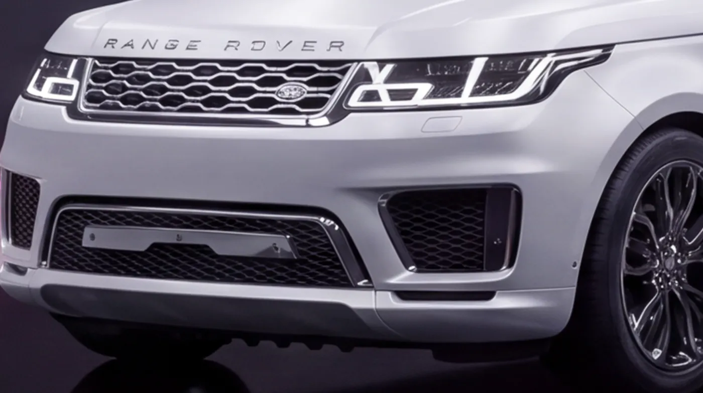 Close-up of the Range Rover Sport's grille and bumper in factory chrome