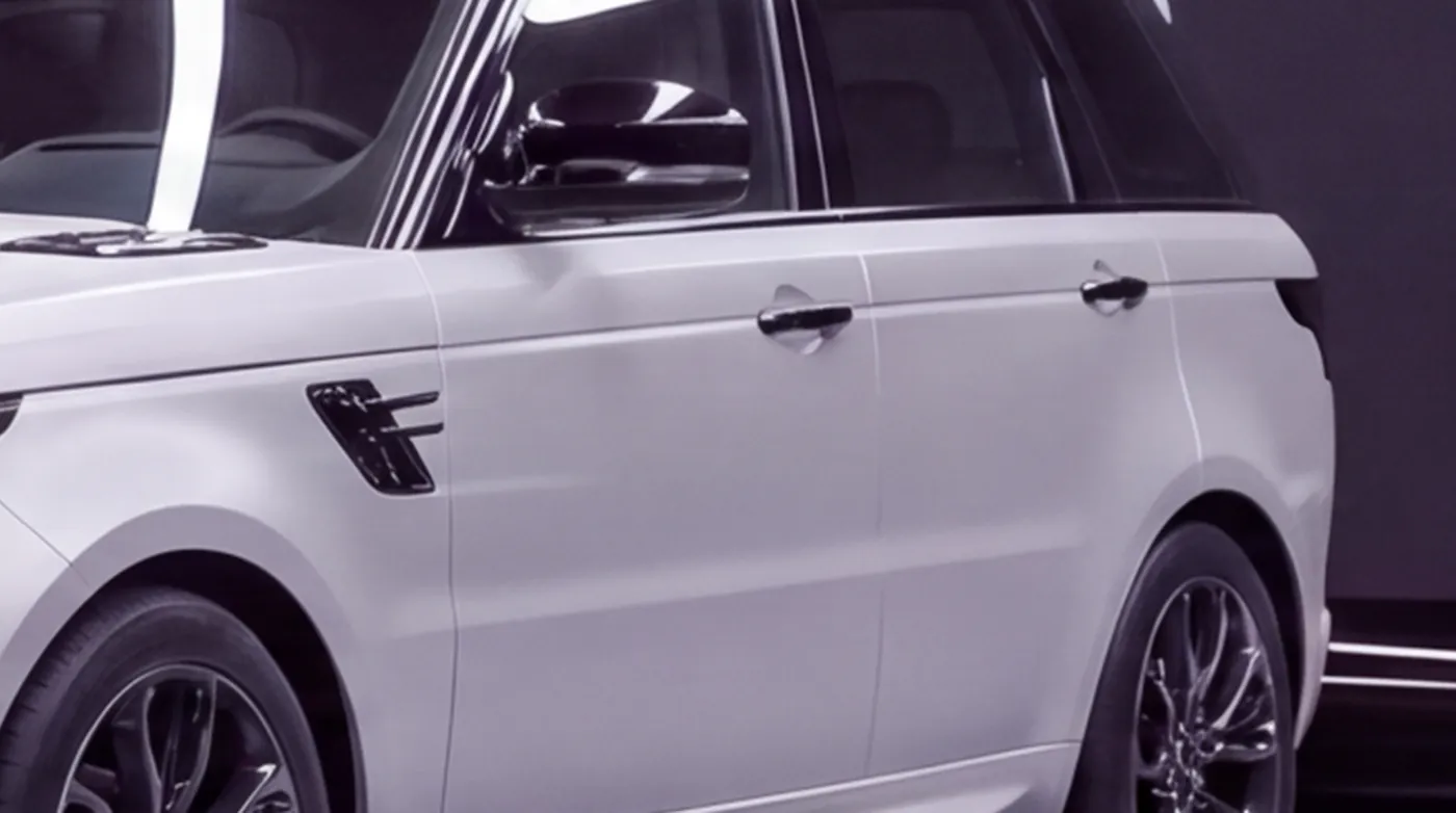Close-up of the Range Rover Sport's vents, mirrors and handles wrapped in gloss black