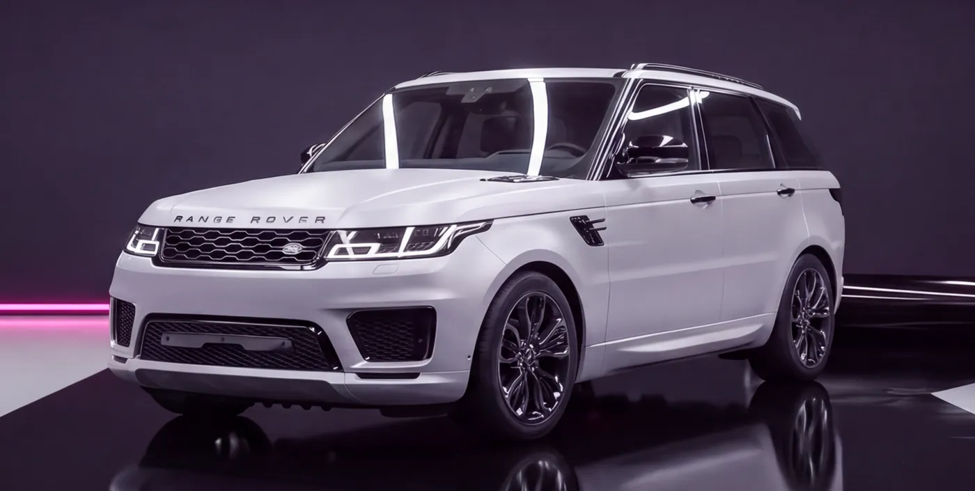 A Range Rover Sport with its chrome trim wrapped in gloss black., after