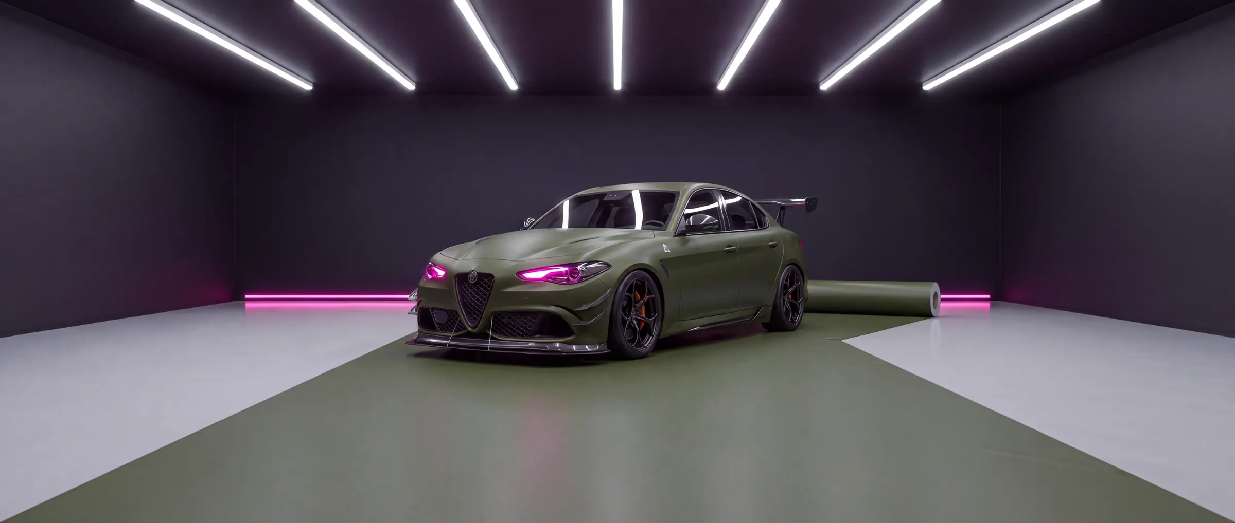 The same saloon wrapped in matte olive, in the wrapping bay